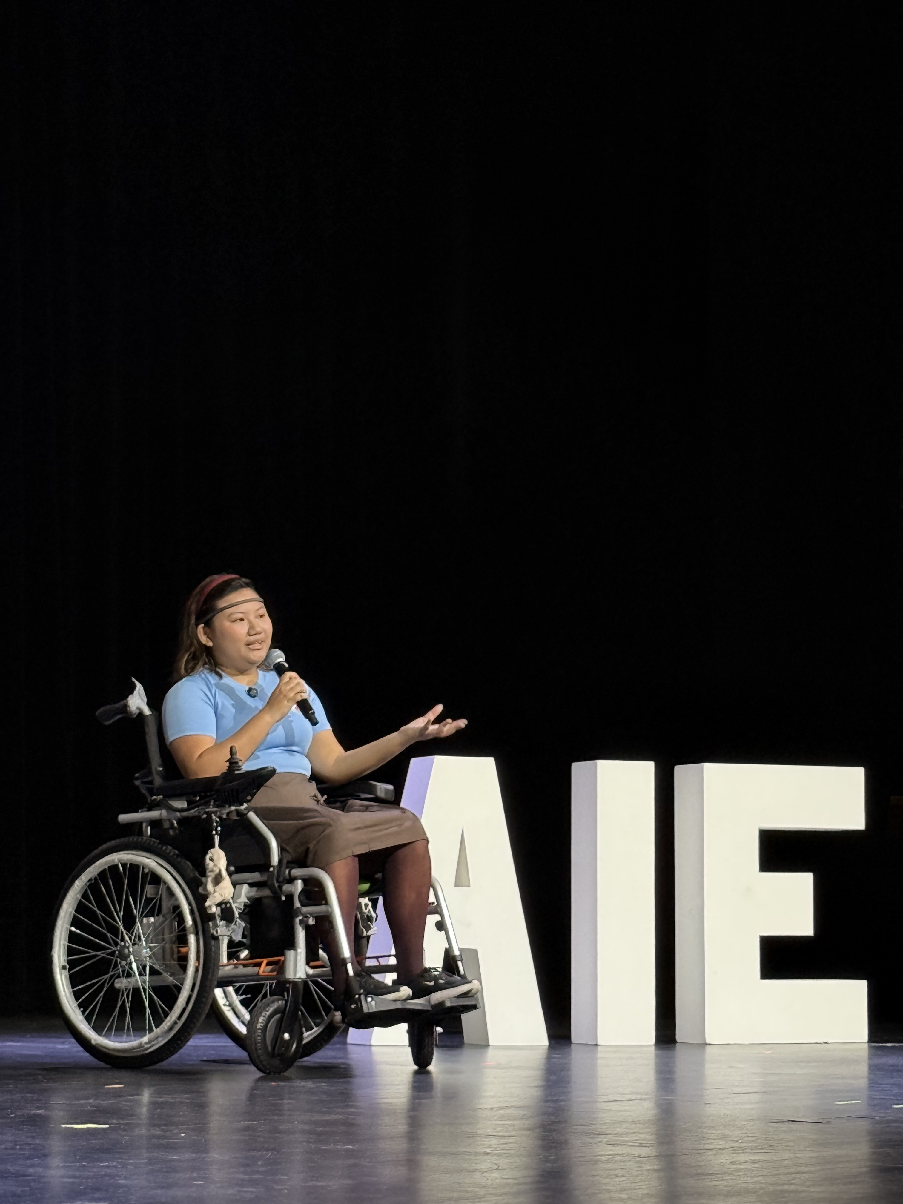 Justin Baird's ALS painting demo on stage at AI Engineer Singapore